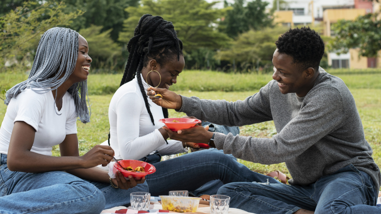 full-shot-friends-eating-lunch-together